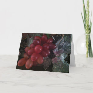 Raisins sur la carte de voeux de feuille