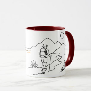 Randonneur dans un mug désertique avec une citatio