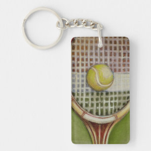 Raquette de tennis avec balle posée sur le court