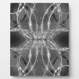 Razor wire against dark clouds fotoplatte