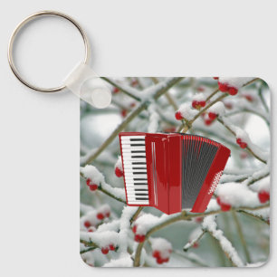 Red Accordion - Berries im Schnee Hintergrund Schlüsselanhänger