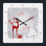 Red and Gray Ho Ho Ho Christmas Clock with Deer Quadratische Wanduhr<br><div class="desc">This festive red, grey, and white "Ho Ho Ho" clock has a deer with antlers adorned with holly and berries, a red gift with ribbons, snowflakes, stars, and a variety of Christmas trees on a foggy gray winter background with a snowy border on it. It would make a lovely addition...</div>