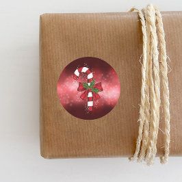 Red Candy Cane auf einem roten Bokeh Hintergrund Runder Aufkleber