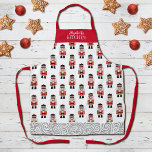 Red Christmas Nutcracker Pattern Schürze<br><div class="desc">Die Schürze wird durch ein einfaches Muster eines Weihnachtslieders in Rot, Schwarz und Silber geschmückt. Macht ein lustiges Weihnachtsgeschenk. Personalisieren Sie es mit Ihrem Namen in dieser Weihnachtszeit. Entworfen für Sie von BlackBerry Boulevard.</div>