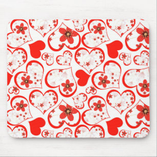 Red hearts and flowers on a white mousepad