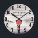 Red umbrella Love couple rustic romantic Wedding R Runde Wanduhr<br><div class="desc">Red umbrella watercolour painting. Love couple with red umbrella. Beautifully hand painted artwork by myself. Perfect for newlyweds,  couple.  Wedding anniversary gift. Valentine’s Day present. You can customize it with your names and date.</div>