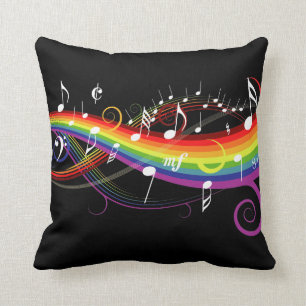 Regenbogen-weißer Musiknoten auf Schwarzem Kissen