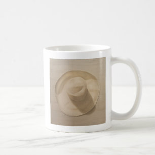 Reisender Hut auf staubiger Tabelle 2010 Kaffeetasse