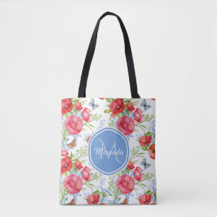 Reizende rote Mohnblumen mit blauen Tasche