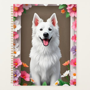 Reizender Hund, umrahmt von Blumen Planer