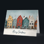 Reizvolles Schneedor "Frohe Weihnachten" Karte<br><div class="desc">Eine herzliche und künstlerische Aquarell-Illustration einer Reihe farbenfroher, nordisch inspirierter Häuser während eines sanften Schneefalls im Winter. Die Häuser sind in Senfgelb-, Tiefrot-, Türkis- und Hellgrautönen gemalt und haben schneebestäubte Dächer und leuchtende Fenster. Kleine getopfte Immergrüne und festliche Dekorationen säumen die Straße vor den Gebäuden. Der elegante, handgeschriebene Text "Frohe...</div>