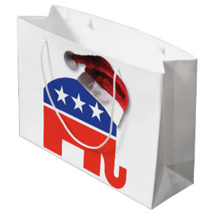 Republikanischer Elefant mit einem Weihnachtshut a Große Geschenktüte