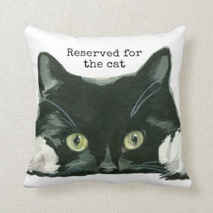 réservé pour le chat noir de coussin de chat