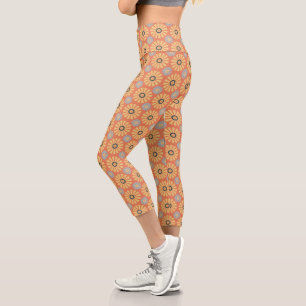 Retro Abstrablau und Orange Daisies Muster Capri Leggings