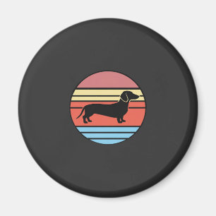 Retro-Dackel-Sonnenuntergangs-Vektor Magnet