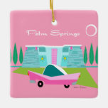 Retro Pink Palm Springs Ceramic Ornament<br><div class="desc">Between the pink background, turquoise mid century modern home, and the classic 1950s car, this design couldn’t be more Palm Springs if it said it in the clouds. Oh, wait, it does say it in the clouds! The blue and teal stone of the house is offset by the sputnik light...</div>