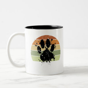 Retro-Sonnenuntergang mit Pfotenabdruck eines Hund Zweifarbige Tasse