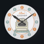 Retro Stove Personalized Kitchen Clock Runde Wanduhr<br><div class="desc">A clock featuring an illustration of a retro beige kitchen stove.  Personalize with your name about illustration.  Clock features white numbers on orange and blue dots.</div>