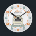 Retro Stove Personalized Kitchen Clock Runde Wanduhr<br><div class="desc">A clock featuring an illustration of a retro beige kitchen stove.  Personalize with your name about illustration.  Clock features white numbers on orange and blue dots.</div>