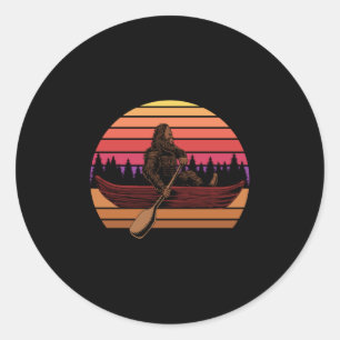 Retro Vintager Bigfoot in Canoe Runder Aufkleber