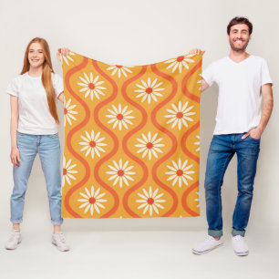 Retroweiße Blumen auf mittelalterlicher Orange-Oge Fleecedecke