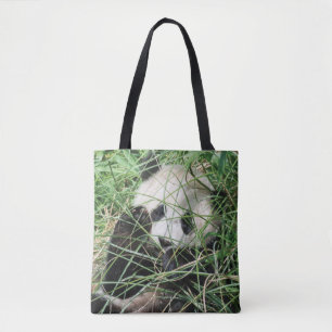 Riesenpanda versteckt sich im Gras Tasche