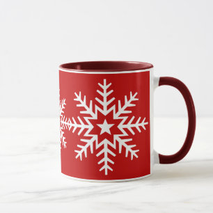 Riesige weiße Schneeflocke auf roter Tasse