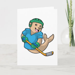 Robbe beim Eishockey mit Eishockeyschläger Karte