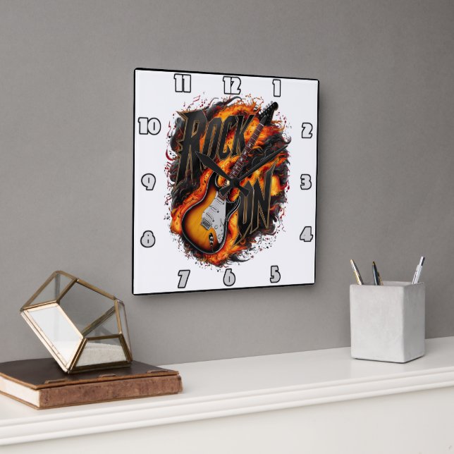 Rockgitarre inmitten feuriger Flammen bei einem Ko Quadratische Wanduhr (Büro)