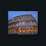 Roman Colosseum at Night Leinwanddruck<br><div class="desc">A striking foto of the colosseum which is an ancient landmark in Rom,  Italy. An interesting wink and perspektive. Shot at night with the arches lit up and glowing orange. Der Sky has dark blue stormy clouds above.</div>
