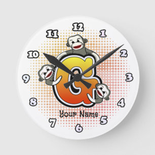 Ronde Horloge Singe à chaussette G monogramme