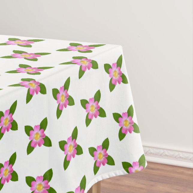 Rosa Blume und grüne Blätter auf weißer Tablette Tischdecke (Beispiel)