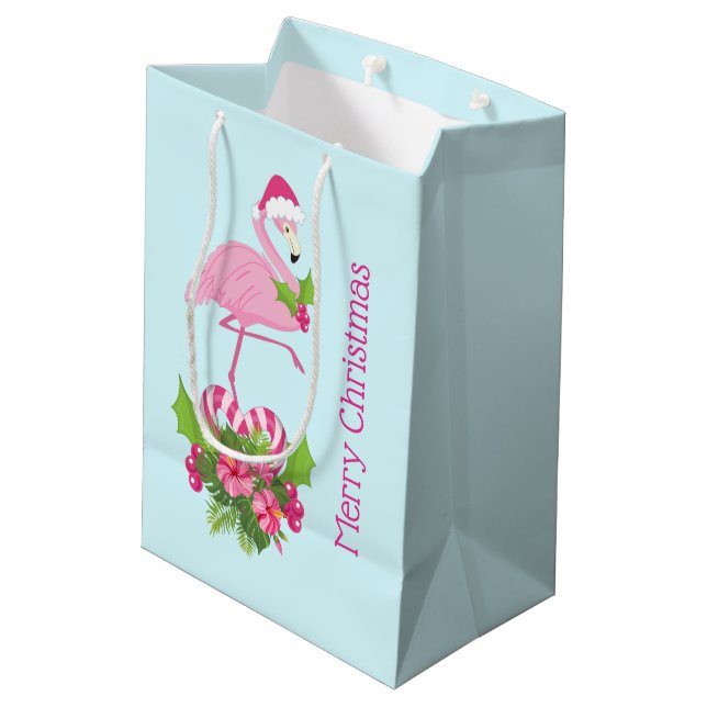 Rosa Flamingo in Weihnachtsmannmütze mit Candy Can Mittlere Geschenktüte (Rückseite Schrägansicht)