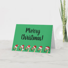 Rosa Flamingos in roten Weihnachtsmannmützen Weihn Feiertagskarte