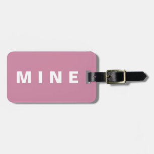 Rosa Gepäckmarke mit dem Aufdruck "Mine" Gepäckanhänger