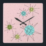 Rosa Iconic AtomSternexplosion-Wand-Uhr Quadratische Wanduhr<br><div class="desc">Dieses quadrieren rosa Iconic AtomSternexplosionen Acrylwand-Uhrmustereigenschaftsiconic AtomSternexplosionen. Das ist recht! Die alte Schule, First Lady, den Rosa Hintergrund mit Goldtupfen färbte, ist- der perfekte Hintergrund für den vibrierenden Türkis, den beruhigenden Sellerie und farbigen die Kreise des kitschy Birnengrüns. Die Stellen der Farbe werden sporadisch in verschiedene Größen mit der Bedeckung...</div>
