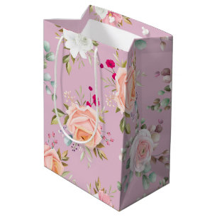 rosa, lila und blumengeschmückte mittlere geschenktüte