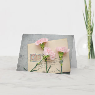 Rosa Nelken und Vintage-Briefkarte Karte