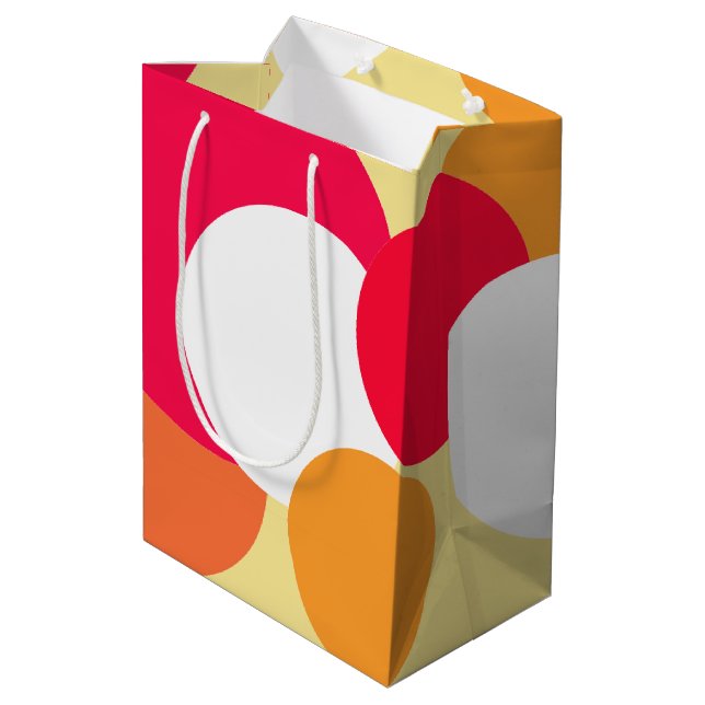 Rosa, orange und gelbe Polka-Punkte Mittlere Geschenktüte (Rückseite Schrägansicht)