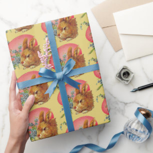 Rosa Ostereier und sonniges auf gelbem Wrapping Pa Geschenkpapier