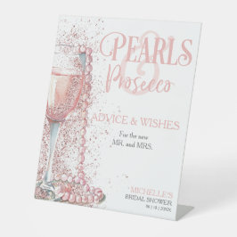 Rosa Perlen und Prosecco-Ratschläge wünschen Sockelschild