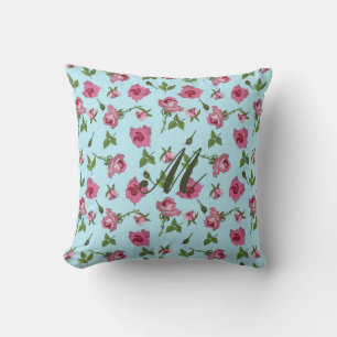 Rosa Rosenmuster auf blauem Monogram Kissen