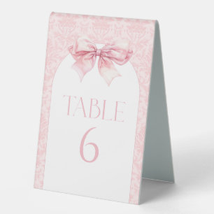 Rosa Schleifen-Boho-Bogen-Babymädchen-Table-Nummme Tischaufsteller