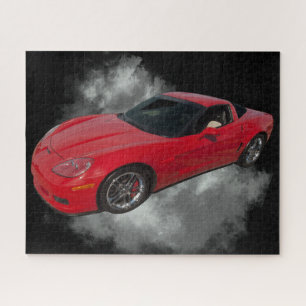 Rote Corvette mit grauem, rauchabnehmbarem Hinterg