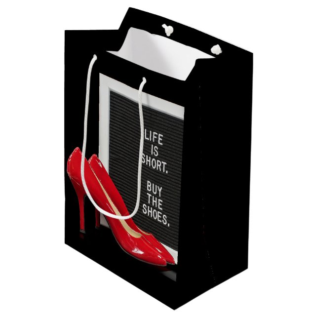 Rote High Heels mit Zeichen Mittlere Geschenktüte (Vorderseite Schrägansicht)