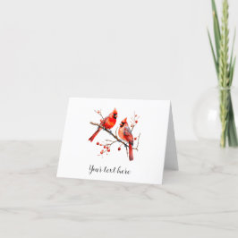 Rote Kardinal Vögel auf der Holly-Tree-Zweigstelle Feiertagskarte