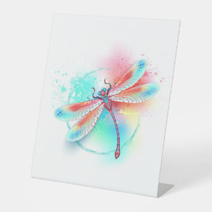 Rote Libelle im Aquarellhintergrund Sockelschild