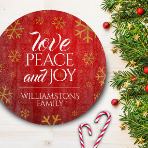 Rote Liebe, Frieden und Freude mit Schneeflocken Schneidebrett