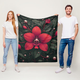 Rote Orchidee blüht mit grünen Blättern Fleecedecke