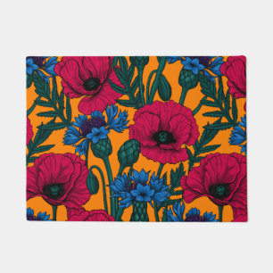 Rote Pfeffer und blaue Kornblumen auf Orange Fußmatte